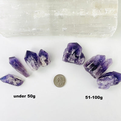 Elestial Amethyst Point/Cluster displayed the under 50g and 51 to 100g next to a quarter 