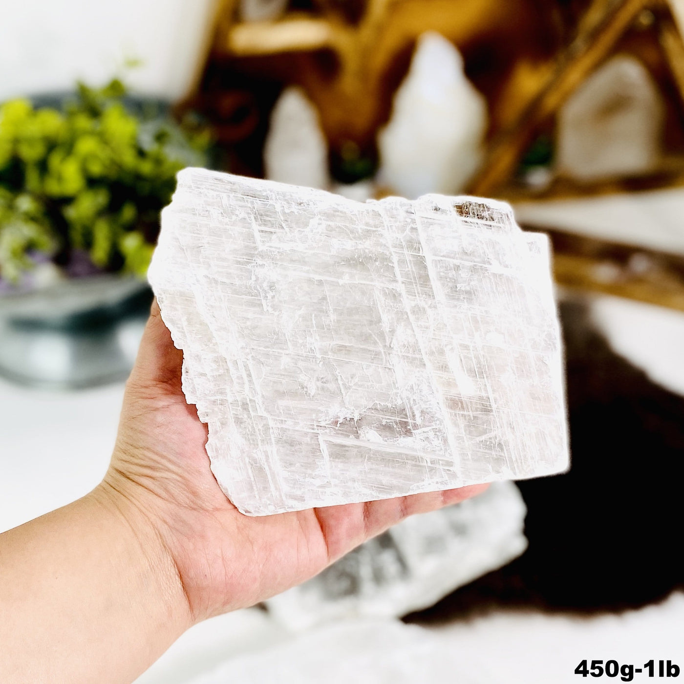 450g-1lb selenite transparent slab in hand for size reference