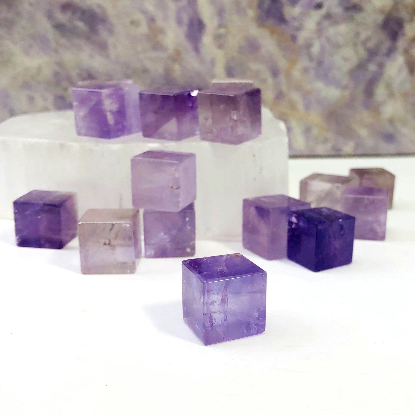amethyst 6 Sided Gemstone Cube displayed on white background