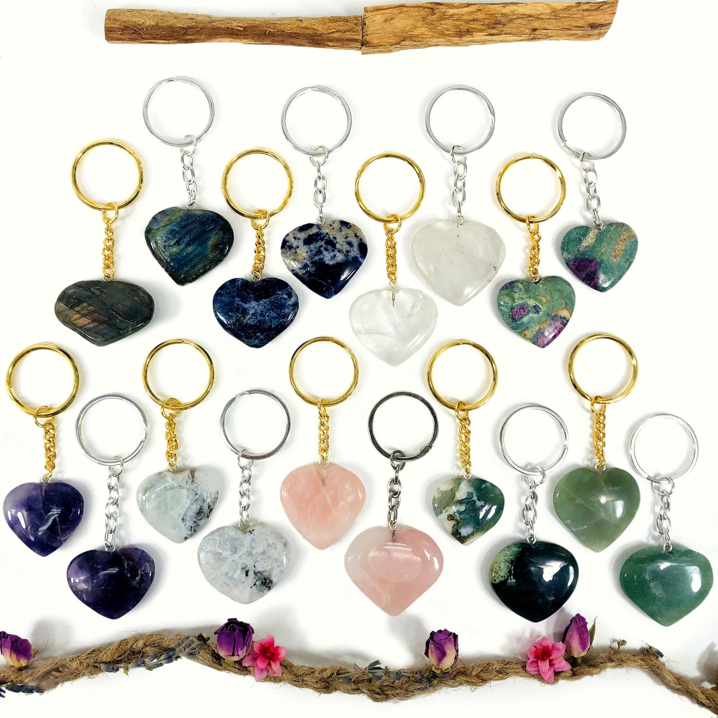 multiple gemstone hearts displayed to show the differences in the crystal types 