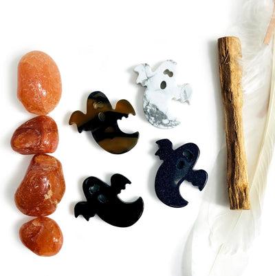 Ghost Gemstone Cabochons, showing 4, one of each stone available, white howlite, black obsidian, natural agate, and blue goldstone