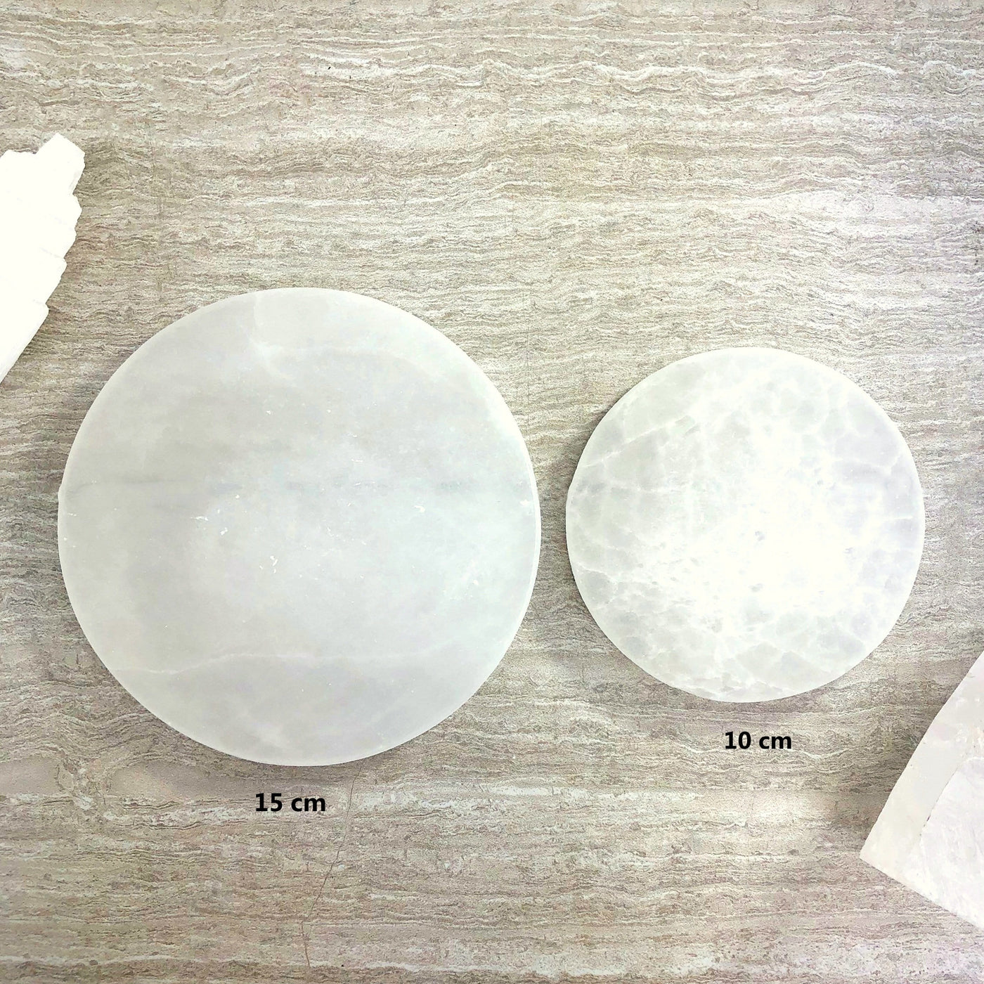 overhead view of 10cm and 15cm round selenite charging plate