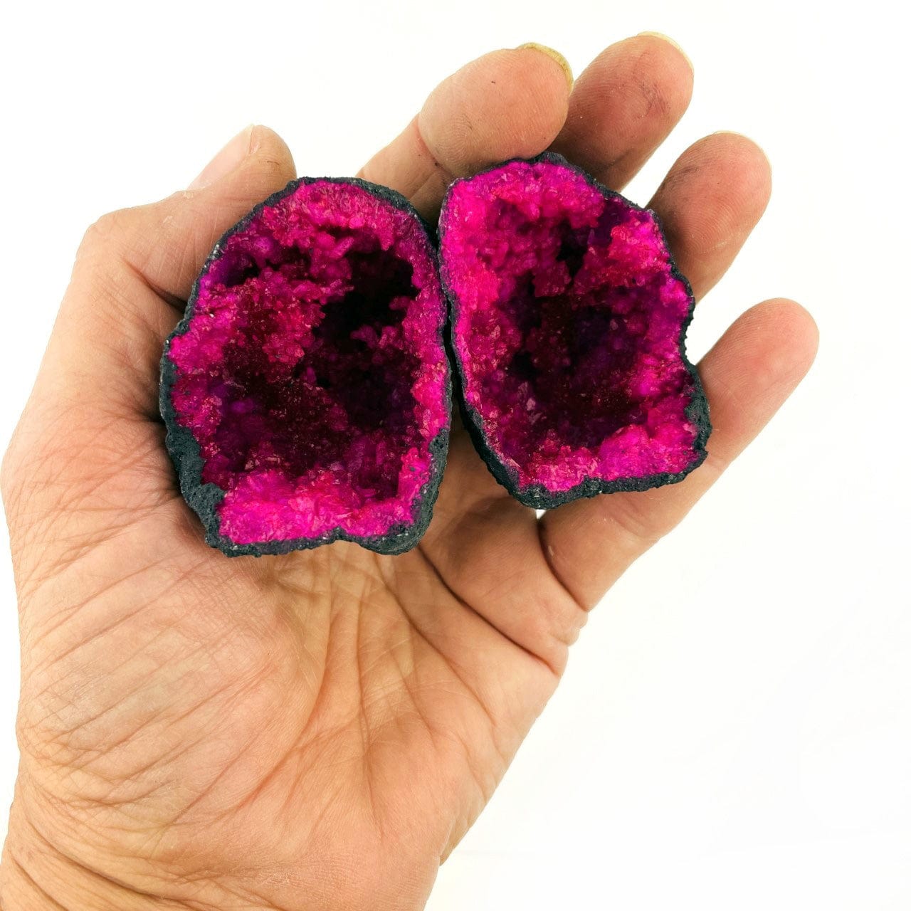 Hot Pink Color Dyed opened Geode in a hand