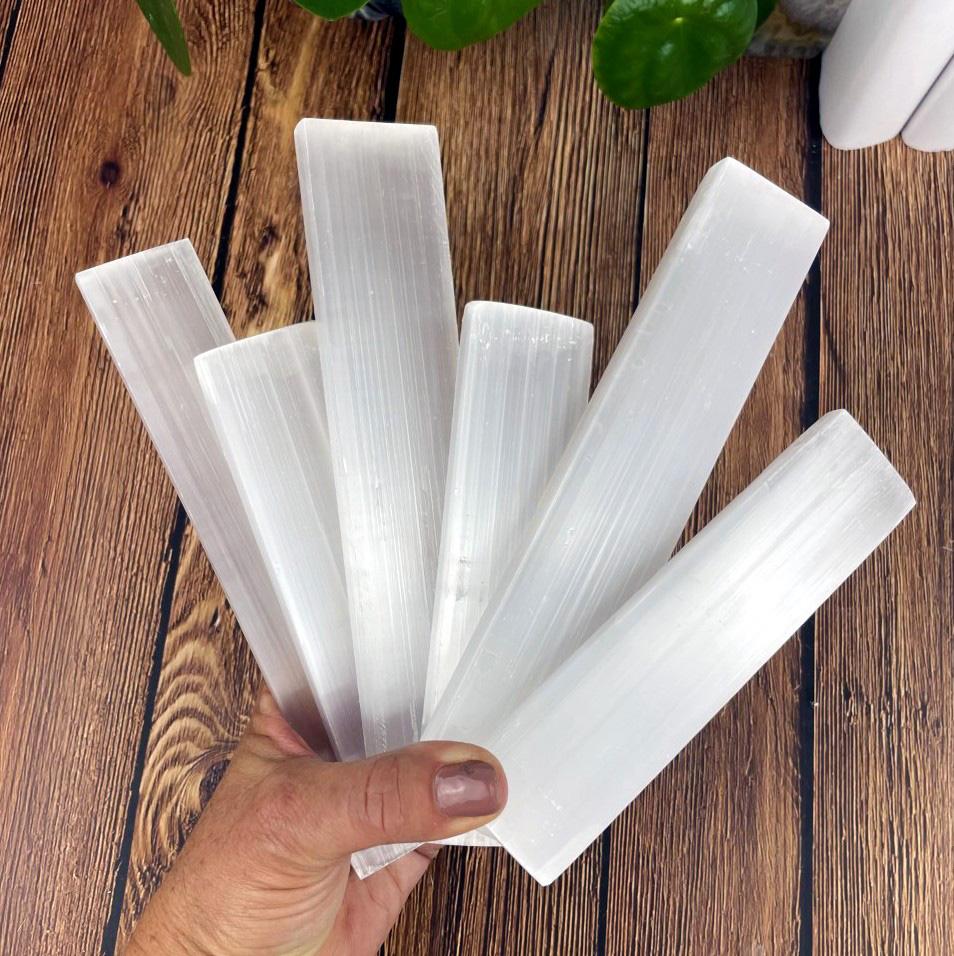 selenite bars in hand for size reference and possible variations