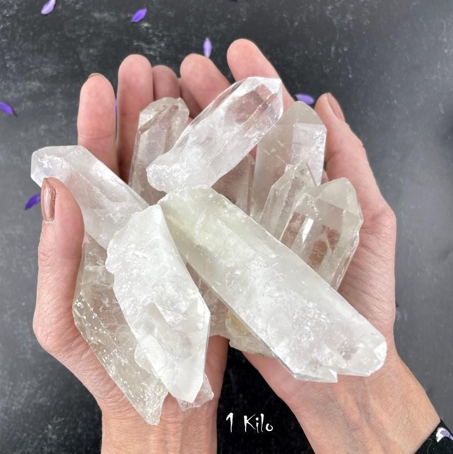 1 Kilogram Bag Crystal Point Grade A in hands to show approx. quatity