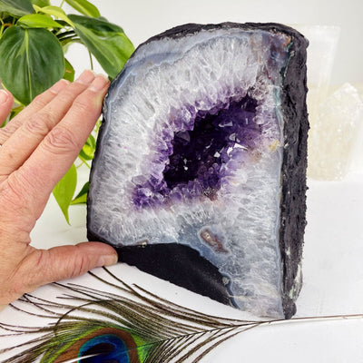 Amethyst Cathedral Geode Crystal with a hand for sizing