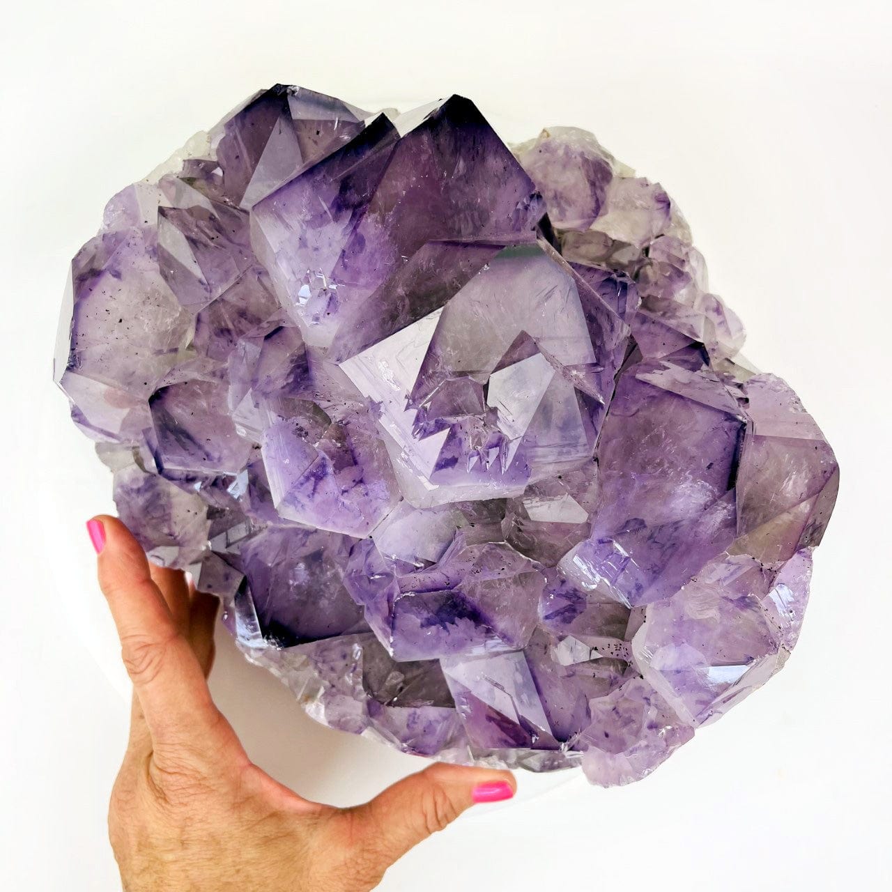 Amethyst Crystal Cluster  - Large Gorgeous Crystals with Polished Sides over head view with hand in the picture for sizing