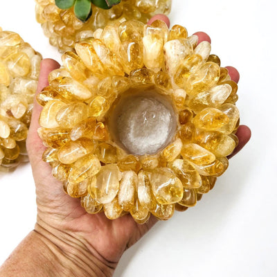 Citrine Tumbled Crystal Candle Holders with one in a hand for size