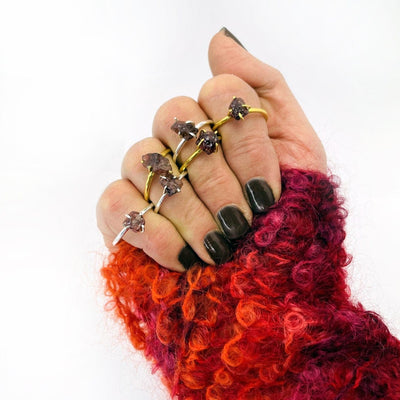 Garnet Gemstone Rings in Gold and Silver on woman's hand