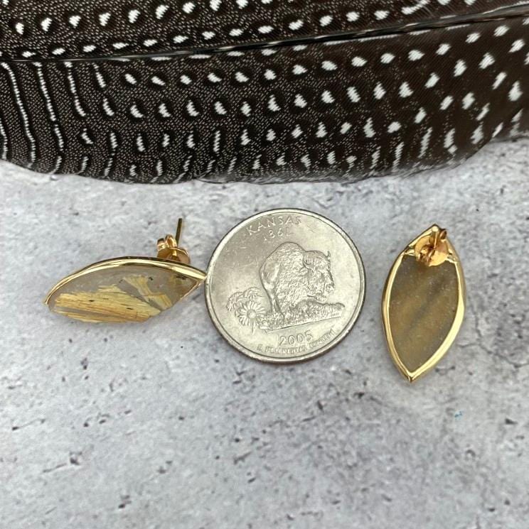 Rutilated Quartz Stud Earrings next to a quarter for size reference