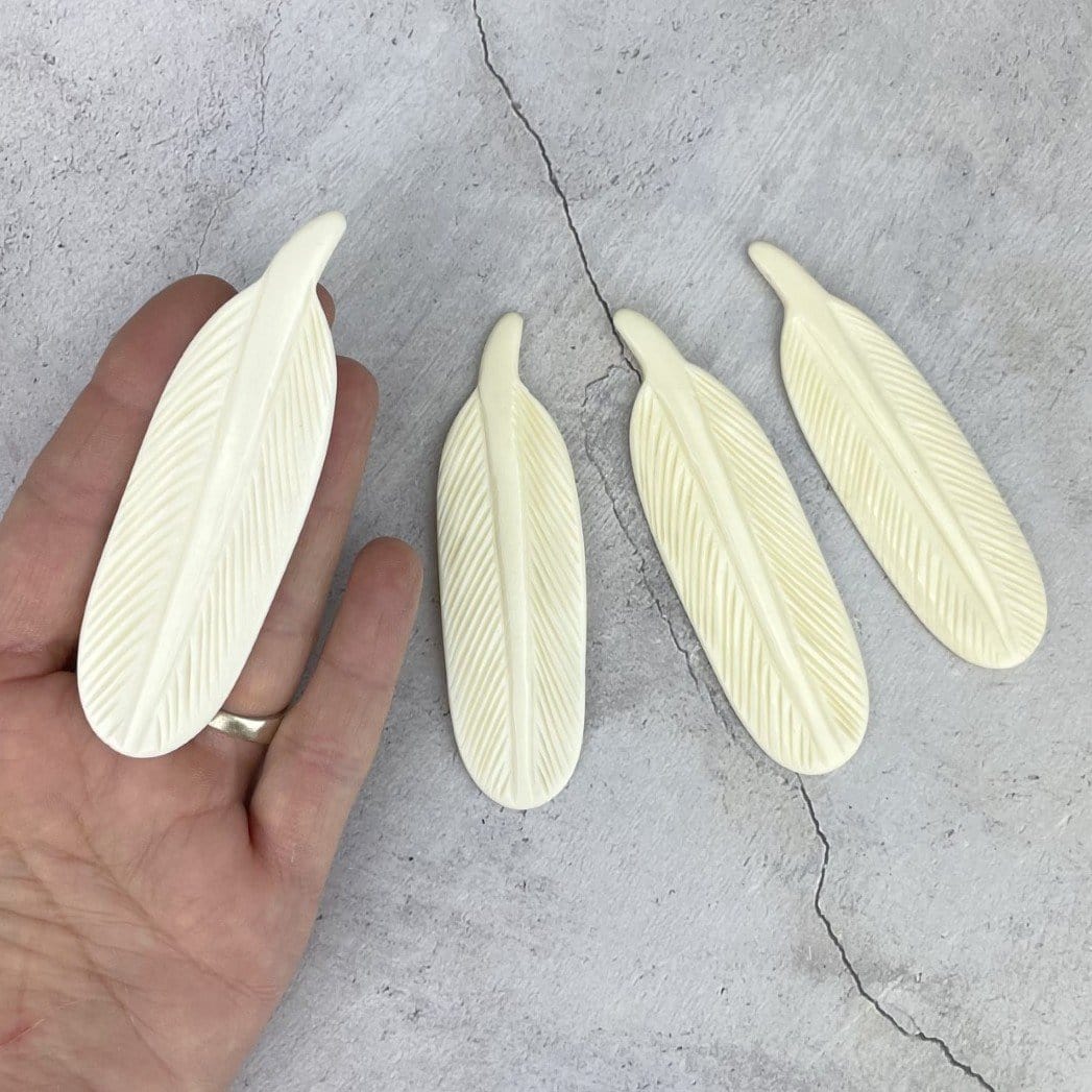 Large Bone Feather Bead  - one in a hand