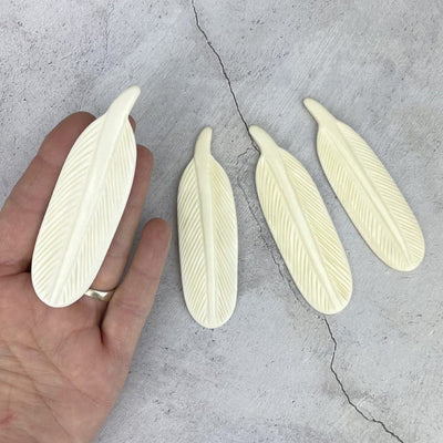 Large Bone Feather Bead  - one in a hand