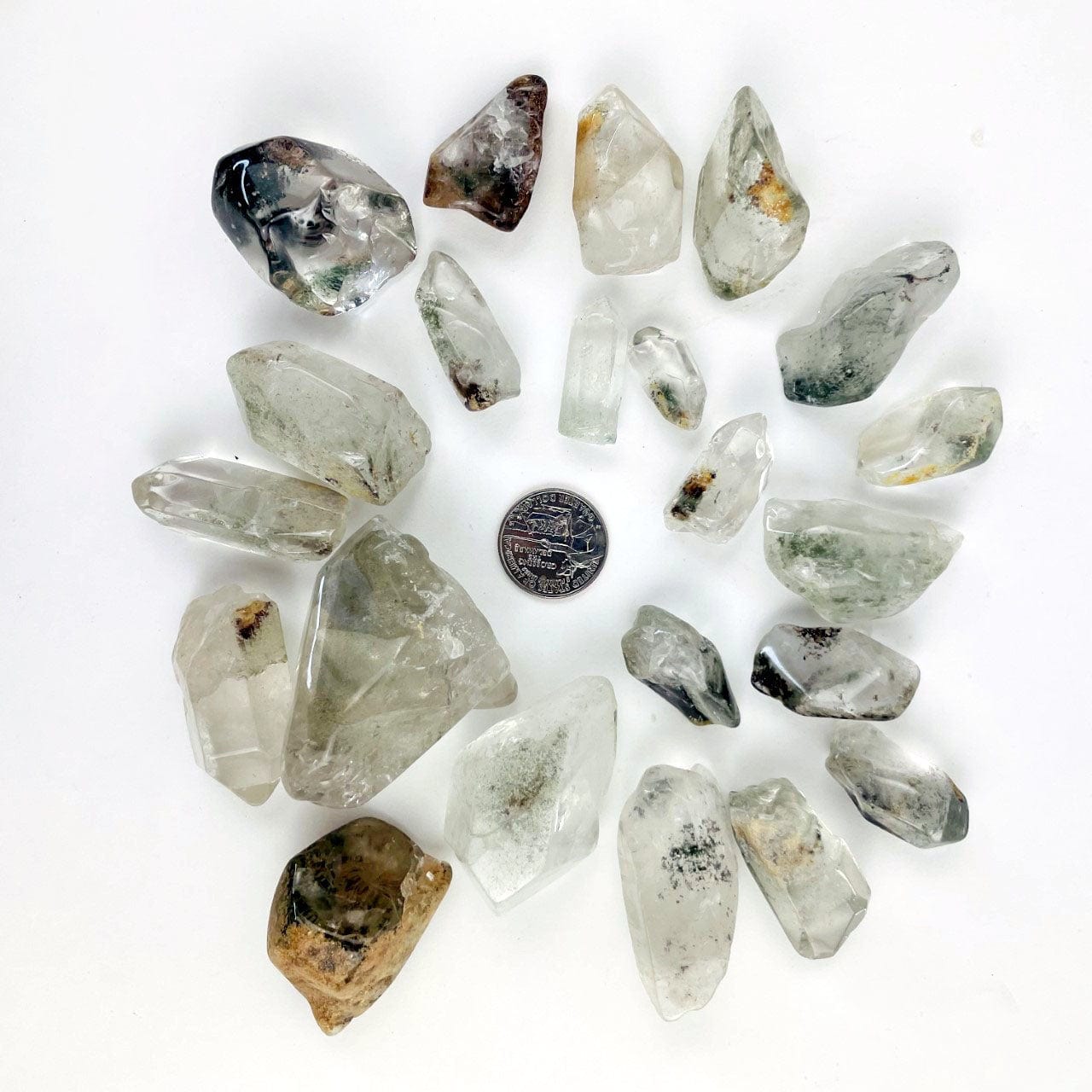 Polished Crystal Quartz Points with Chloride around a quarter for sizing