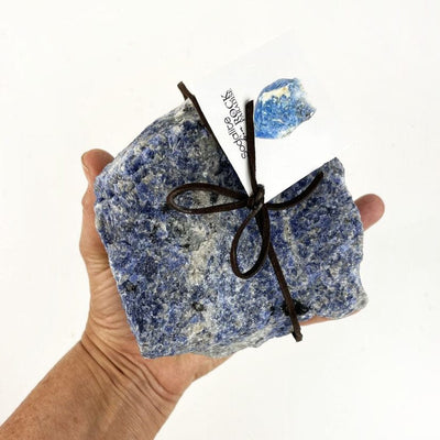 sodalite, 1-2 kilos in a hand for size reference