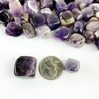 chevron amethyst cubes next to a quarter for size reference 