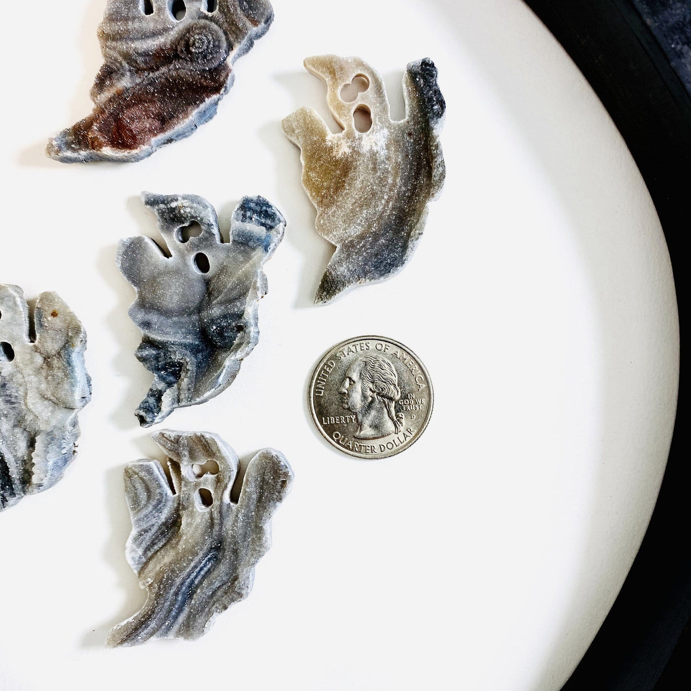 Style 3 Chalcedony Ghost Cabochons next to a quarter for size reference