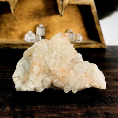 Madagascar Quartz Cluster with decorations in the background