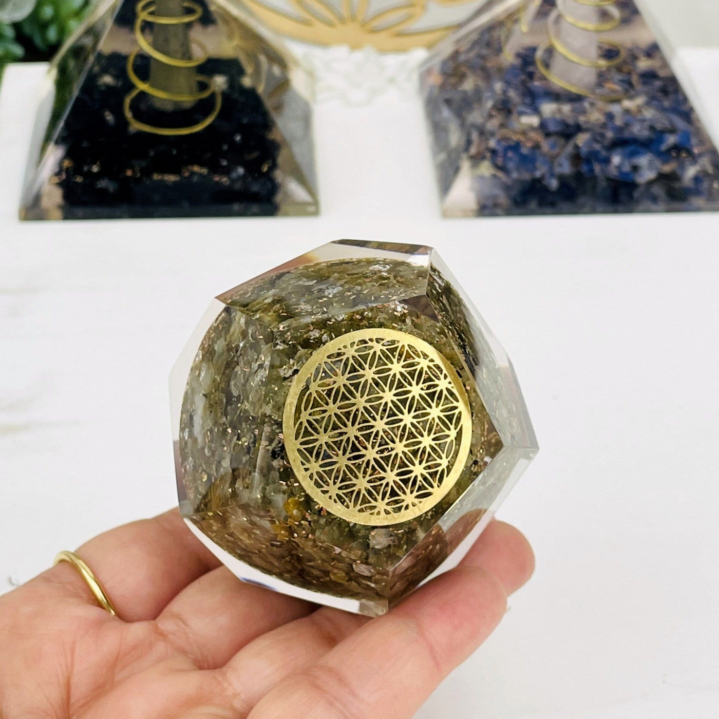 Orgone Energy - Labradorite with Gold Flower of Life Grid - Dodecahedron shaped --front shot view of dodecahedron on hand.
