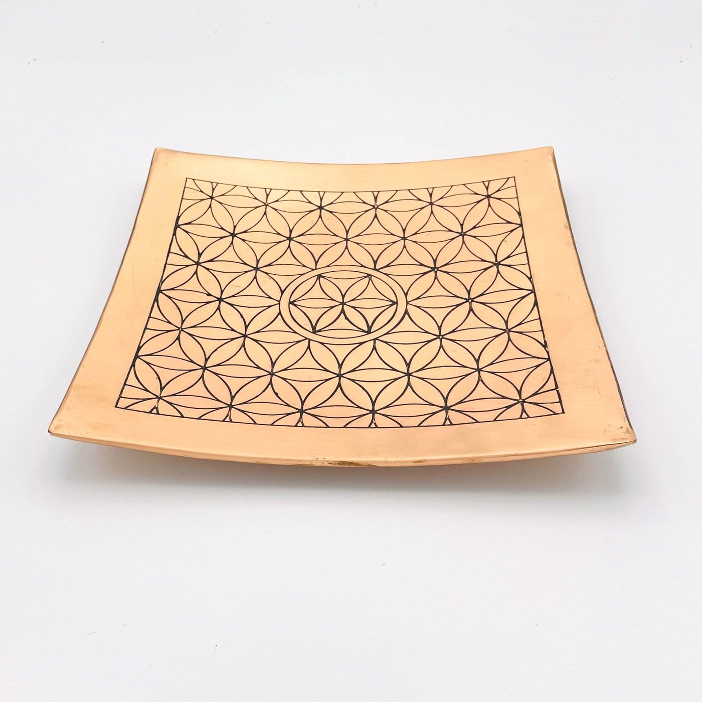 Copper Charging Dish engraved with flower of life side angle view