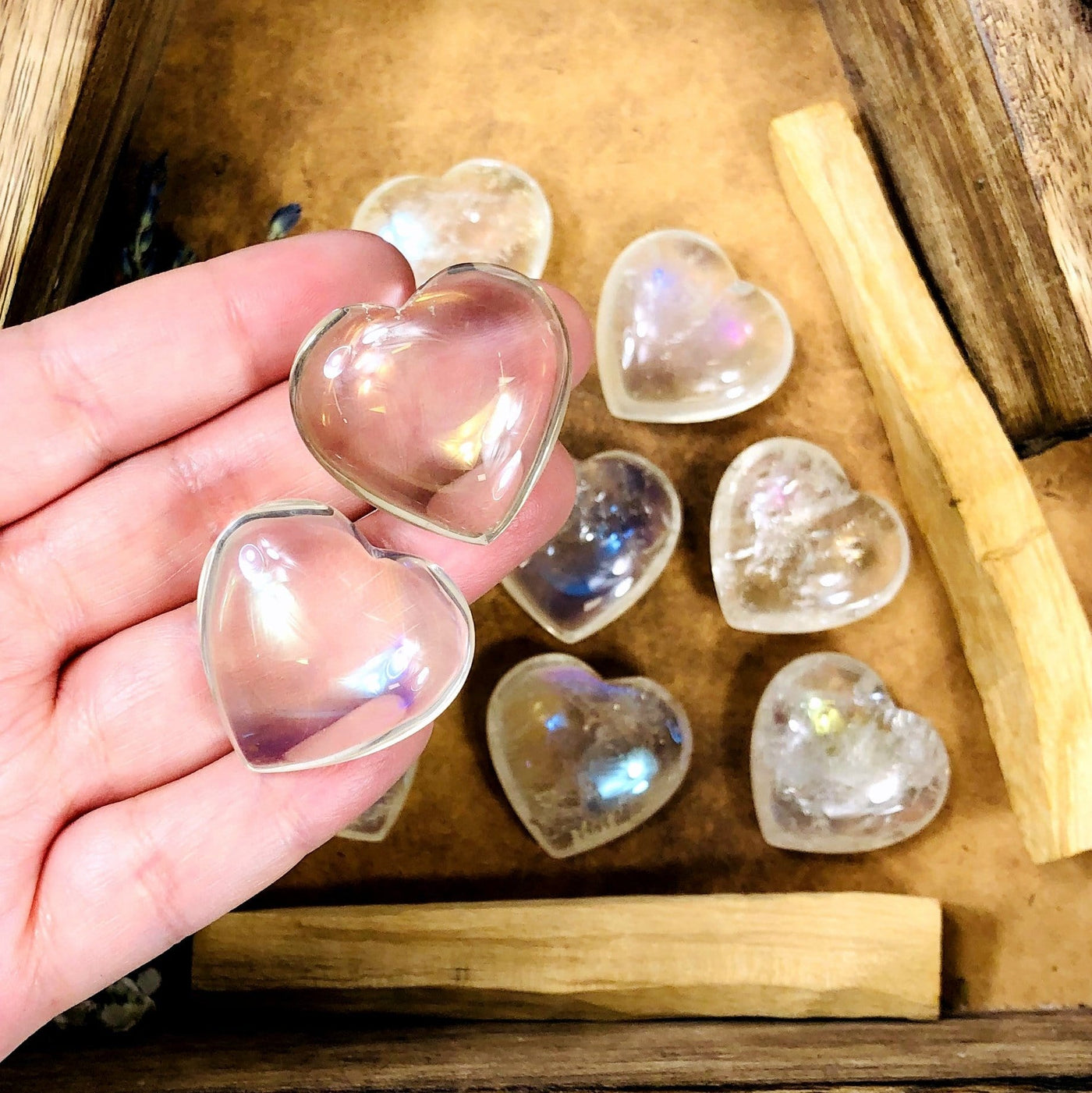 Crystal Heart Angel Aura - Two crystal hearts in hand to show size reference 