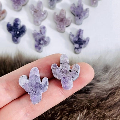 Two Petite Druzy Amethyst Cactus Cabochon placed on hand for size comparison 