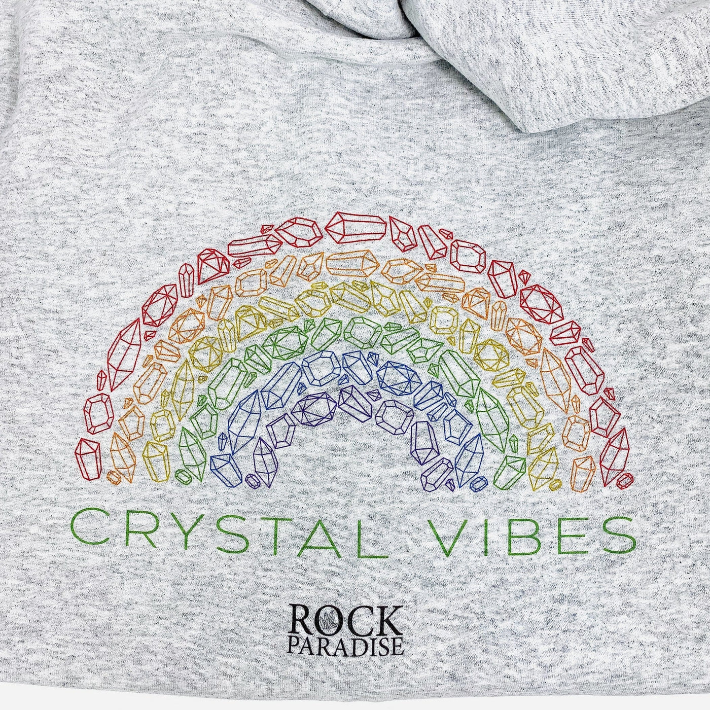 up close shot of crystal vibes logo on gray hoodie