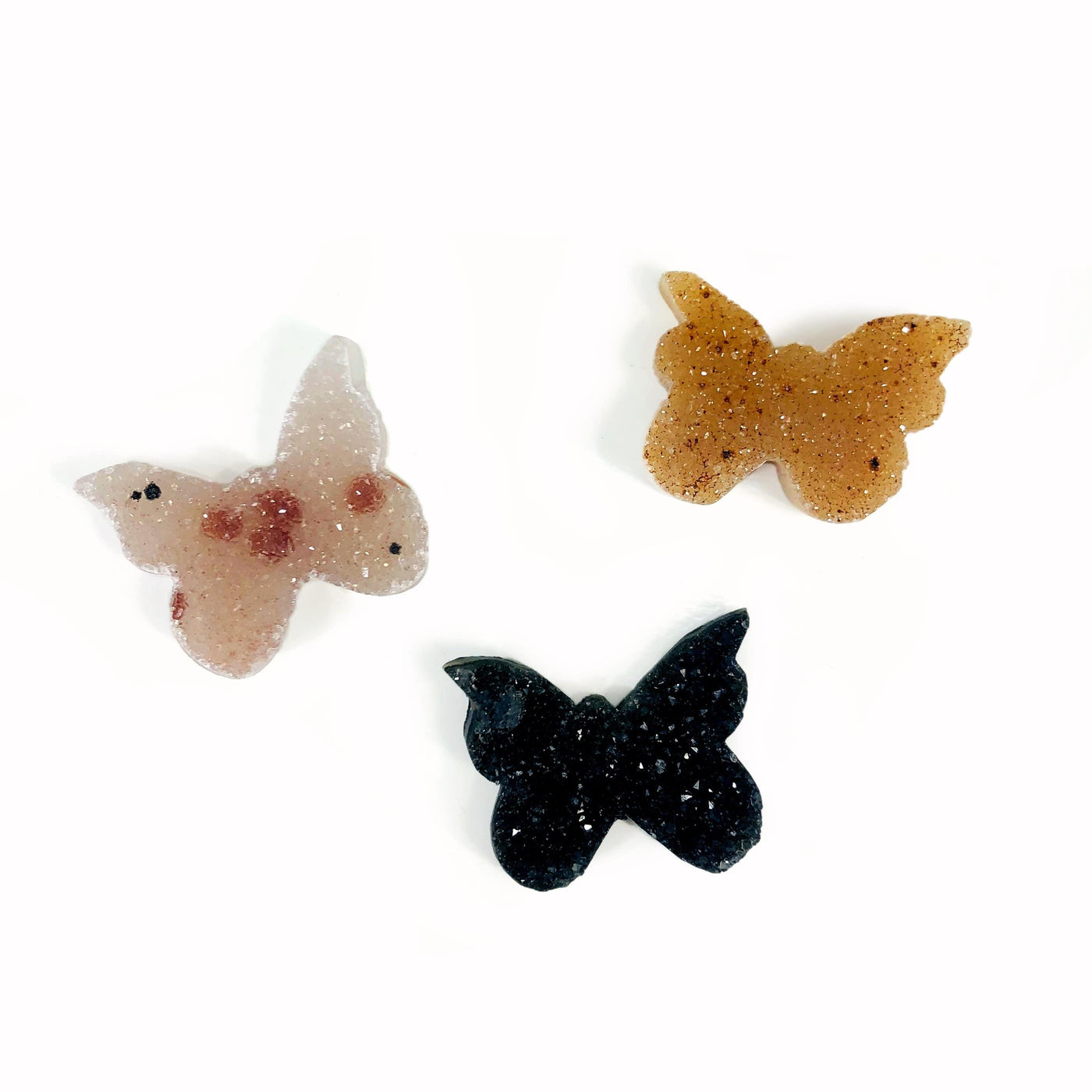 3 druzy butterfly cabochons on white background