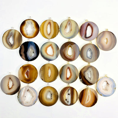 Multiple Natural Agate Circle Slice Pendants to show color and pattern variation.