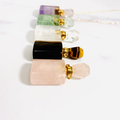 side view of gemstone square bottles for thickness reference