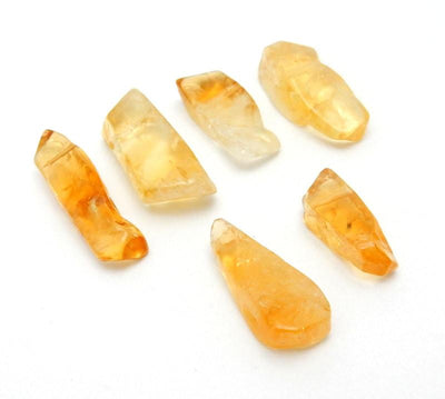 side view of multiple Citrine Freeform Top Side Drilled Beads for thickness reference