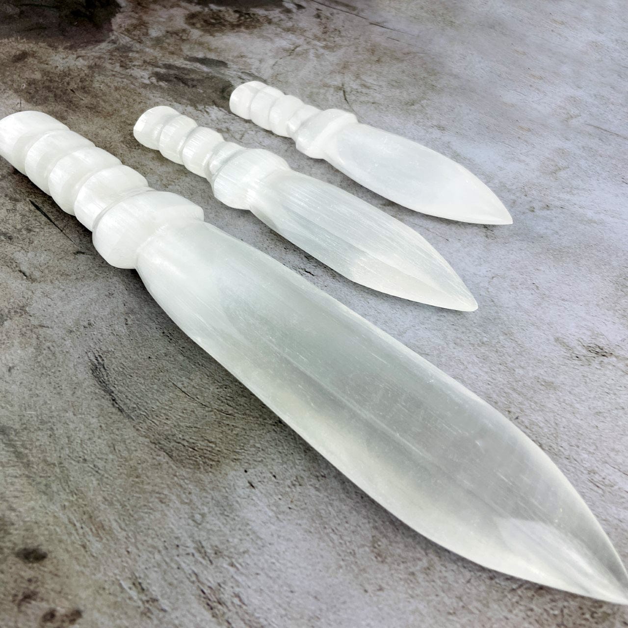 3 sizes of Selenite Knives with Twisted Handles up close
