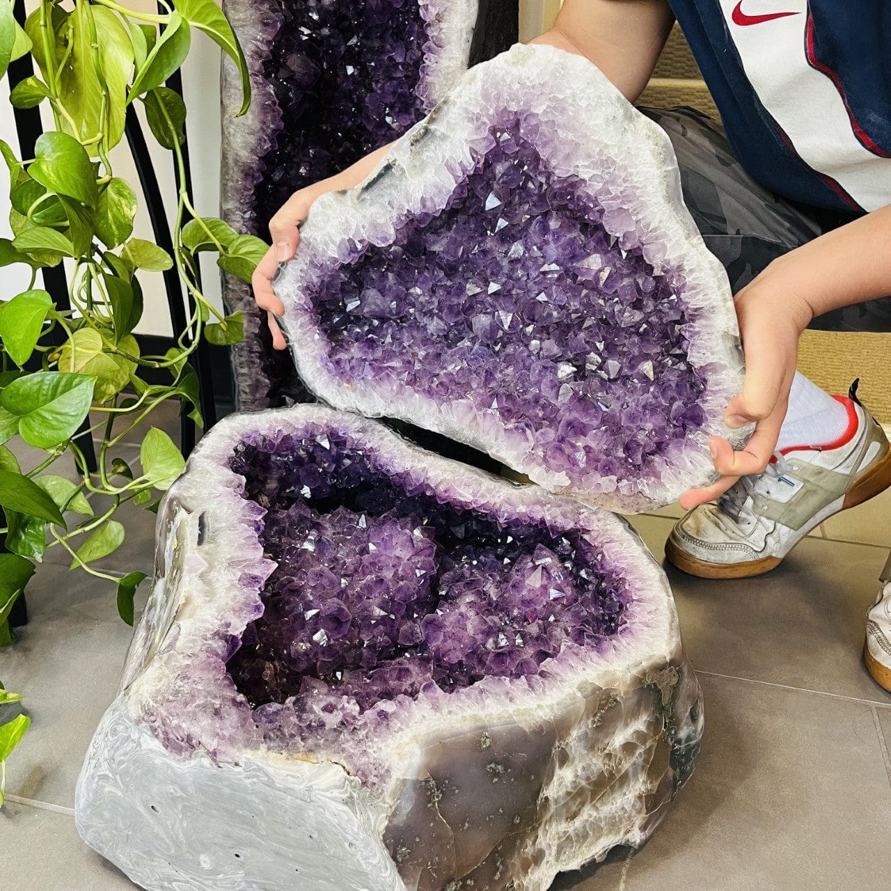 Amethyst Polished Cave Geode with a Lid shown here a man holding the top open.