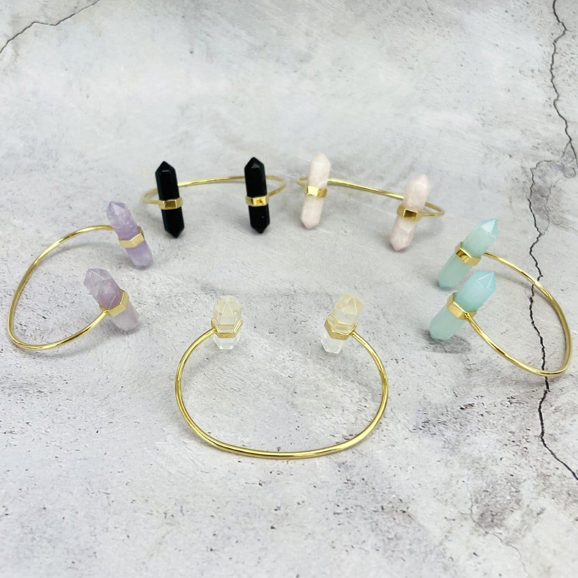 5 gold Crystal Point Cuffs in various crystals