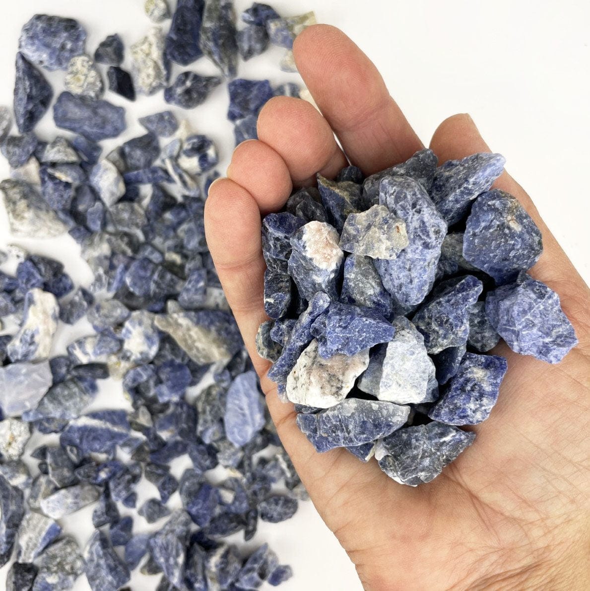 Sodalite Stones in a hand for size