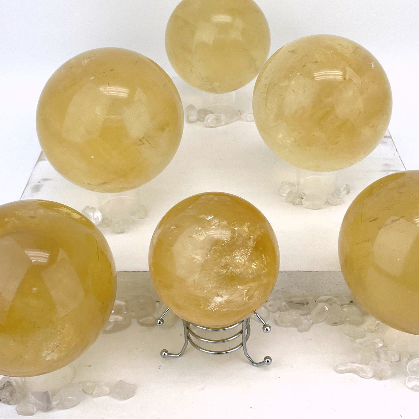 6 Honey Calcite Polished Spheres on white background