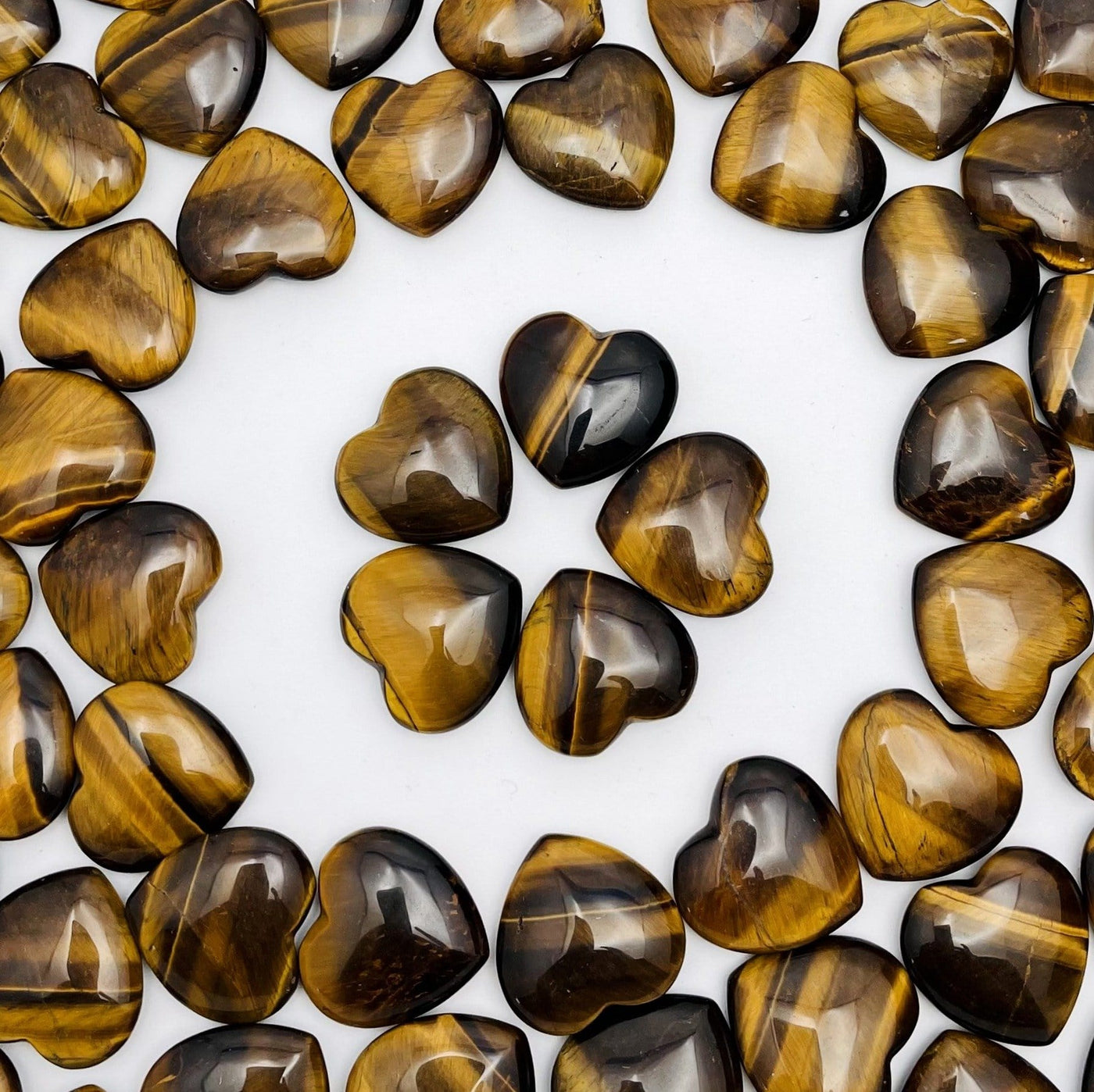 Many tiger eye hearts are shown on the background