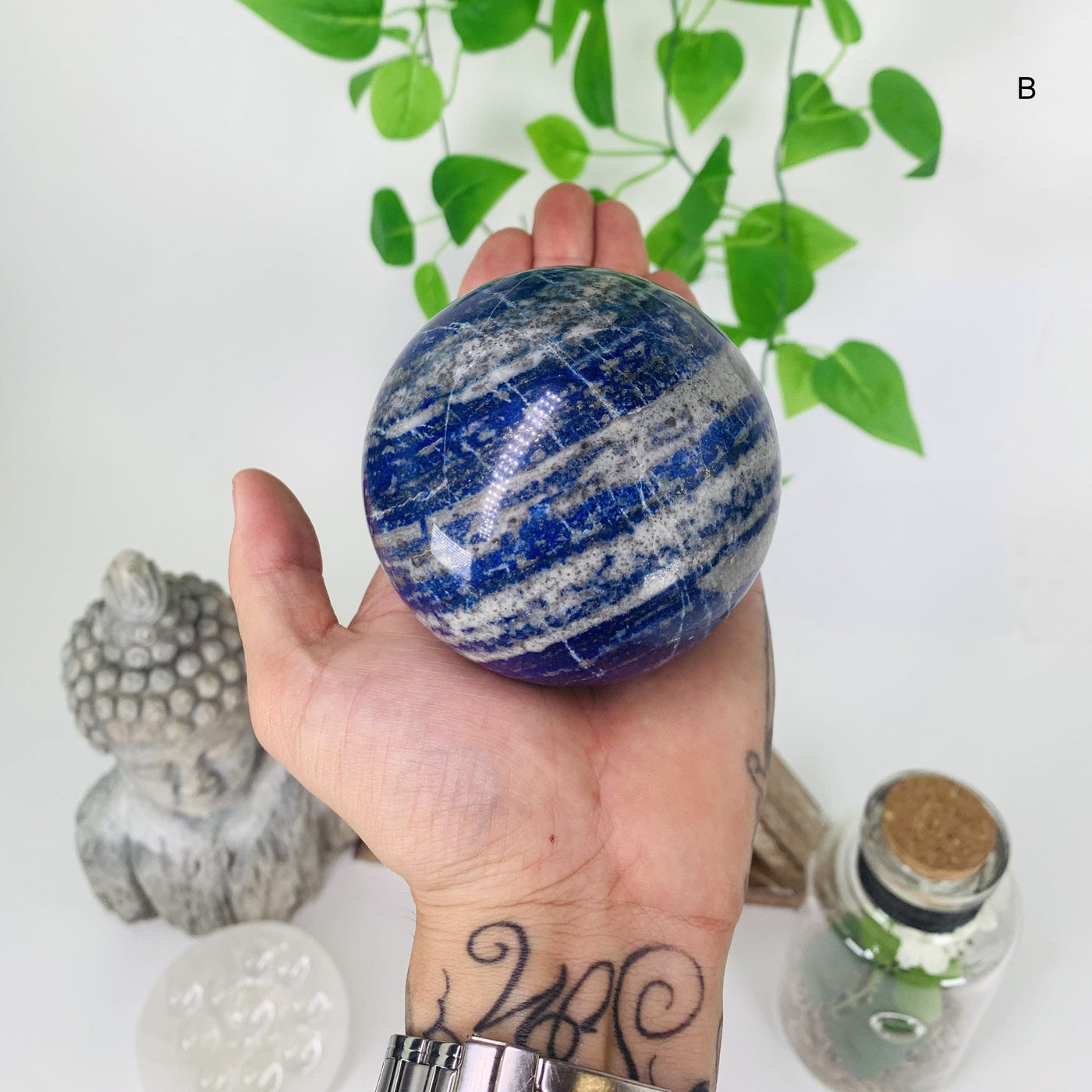 Close up photo of option B for this listing, Lapis Lazuli sphere is also being held for size reference.