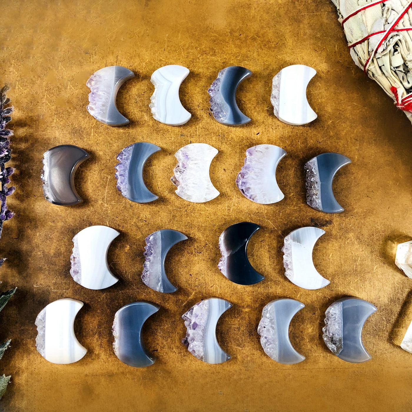 multiple amethyst moon slices displaying the different color and texture patterns 