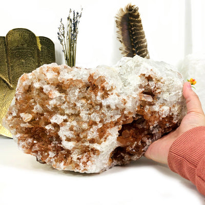 This is a ONE OF A KIND. Tangerine quartz cluster that Measures approx.: 11.50" x 6.75" x 5" being held by a hand
