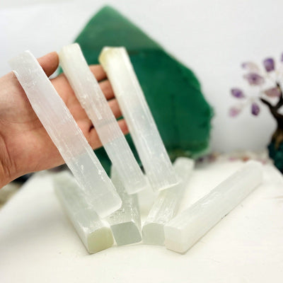 selenite bars in hand and on display for size reference