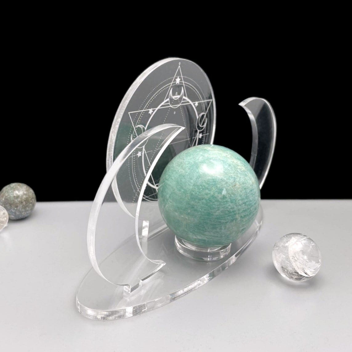 Shown at an angle - Acrylic Sphere Holder Crescent Moons - Six Pointed Star holding a sphere.