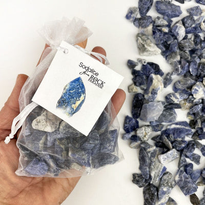 Sodalite Stones - Tied & Tagged in an Organza Bag in a hand