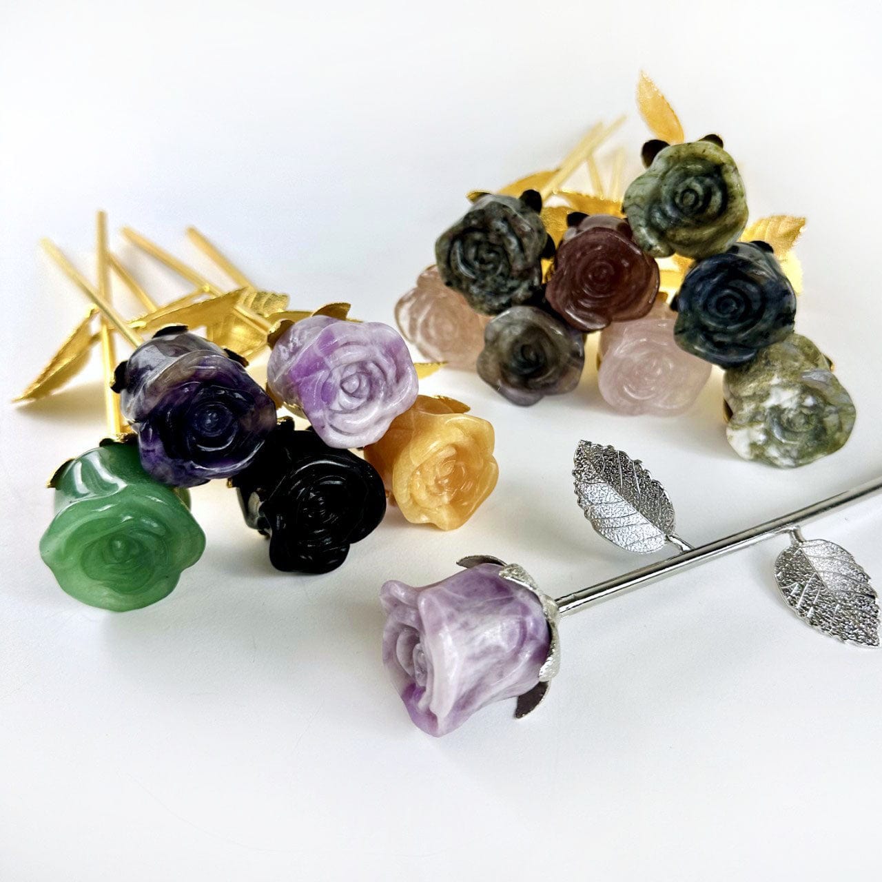 Crystal Rose - Carved Stones shown with gold and silver stems and leaves