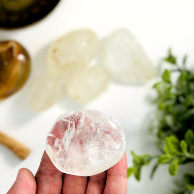 crystal tumbled stone in a hand