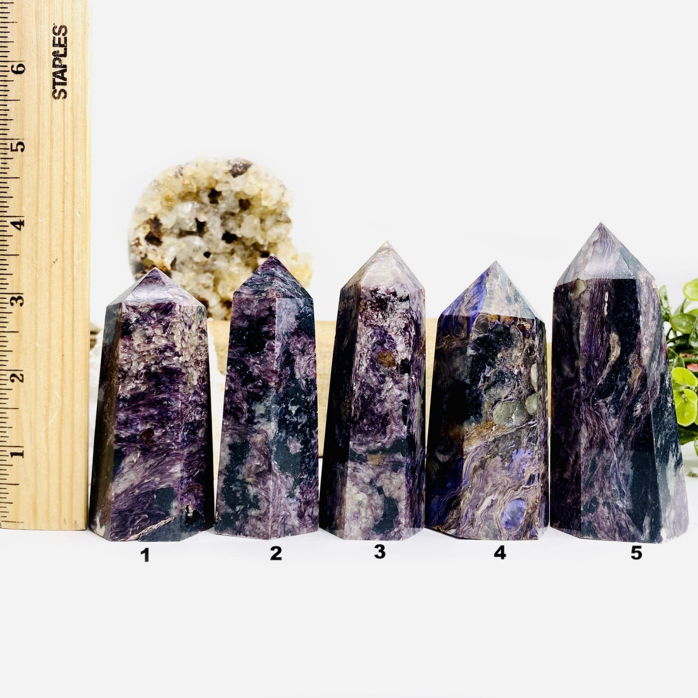 5 Charoite Polished Towers next to a ruler for size reference