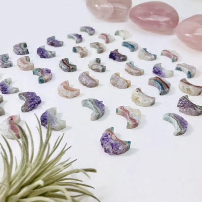amethyst moon crescents with decorations in the background