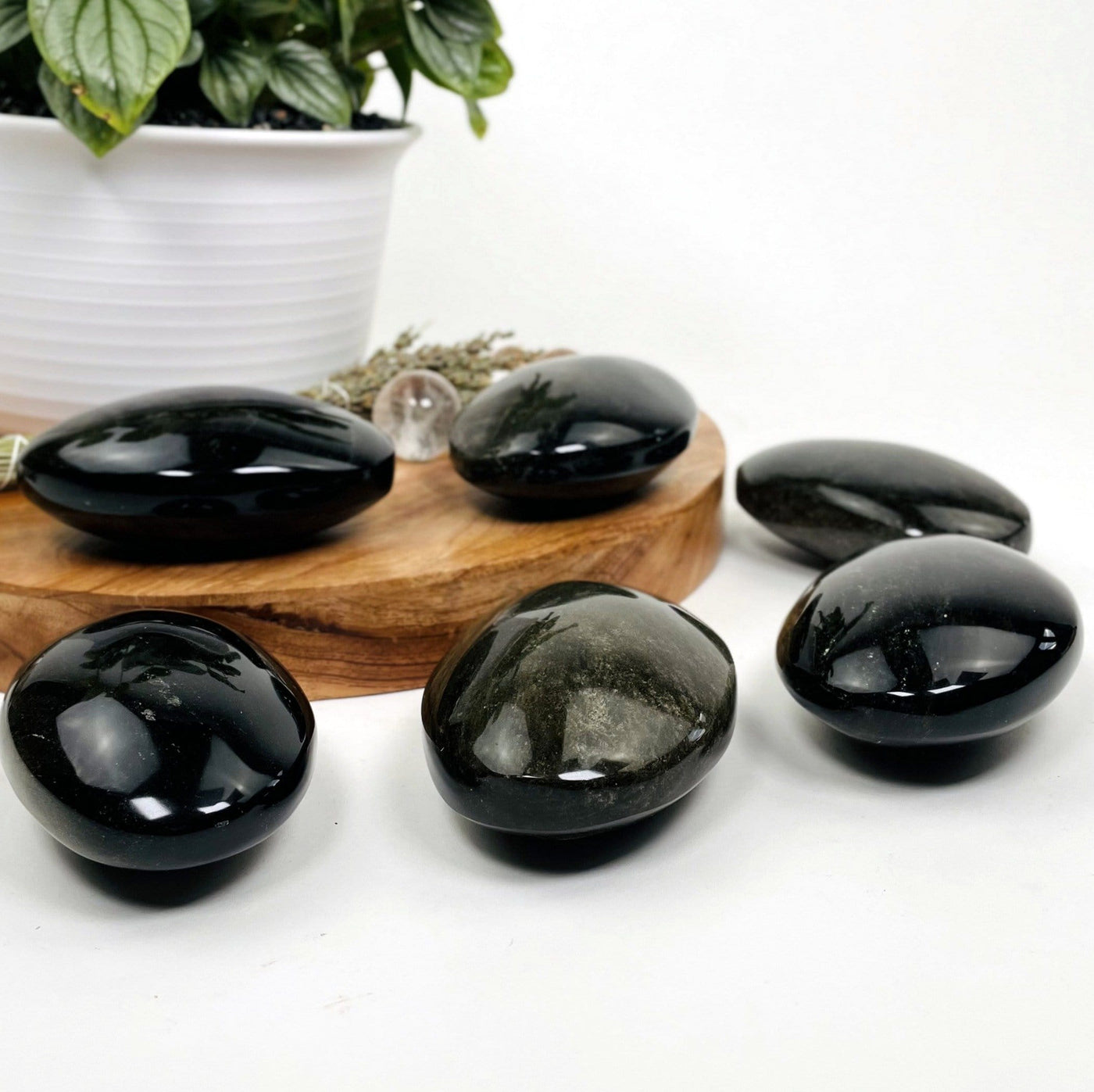 obsidian palm stones on a table