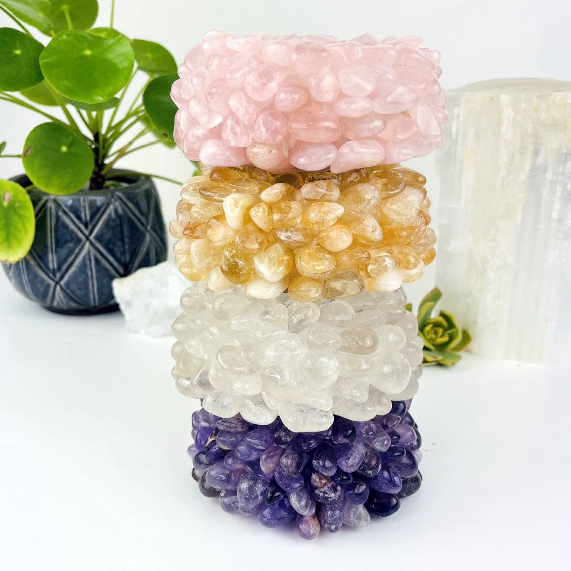 4  choices available of the Tumbled Stone Candle Holder, rose quartz, citrine and amethyst  stacked to see side view