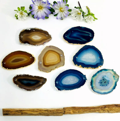 Picture of our natural and blue agate slice plated edge being displayed on a white back ground.