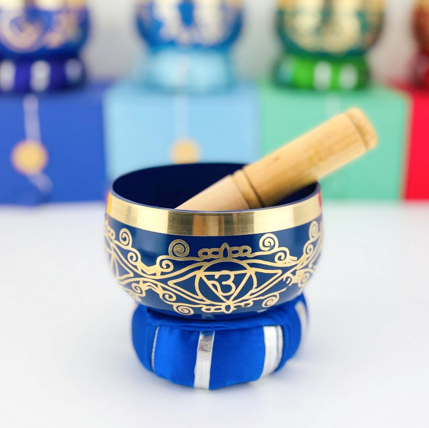 Brass Tibetan Singing Bowls - blue bowl on a table